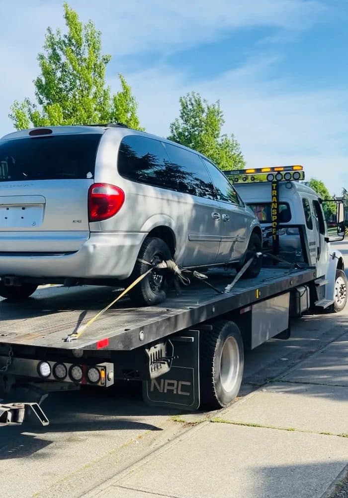 Full Time Towing driver loading a junk car in Surrey